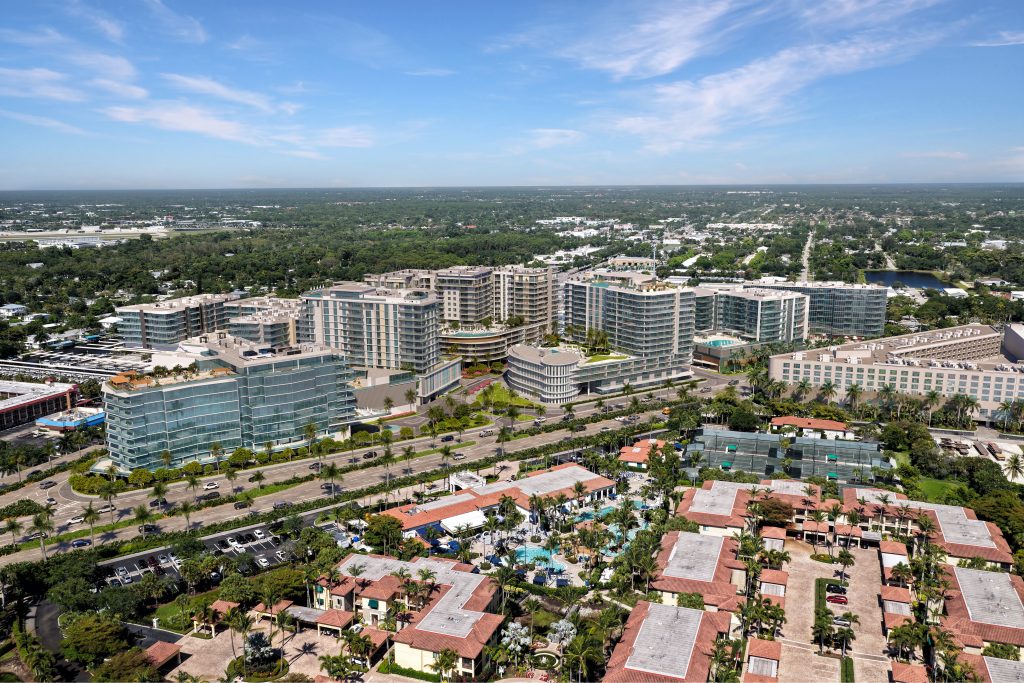 Aerial view rendering of the complete Metropolitan Naples masterplan development featuring AVRA luxury condo buildings and surrounding community.